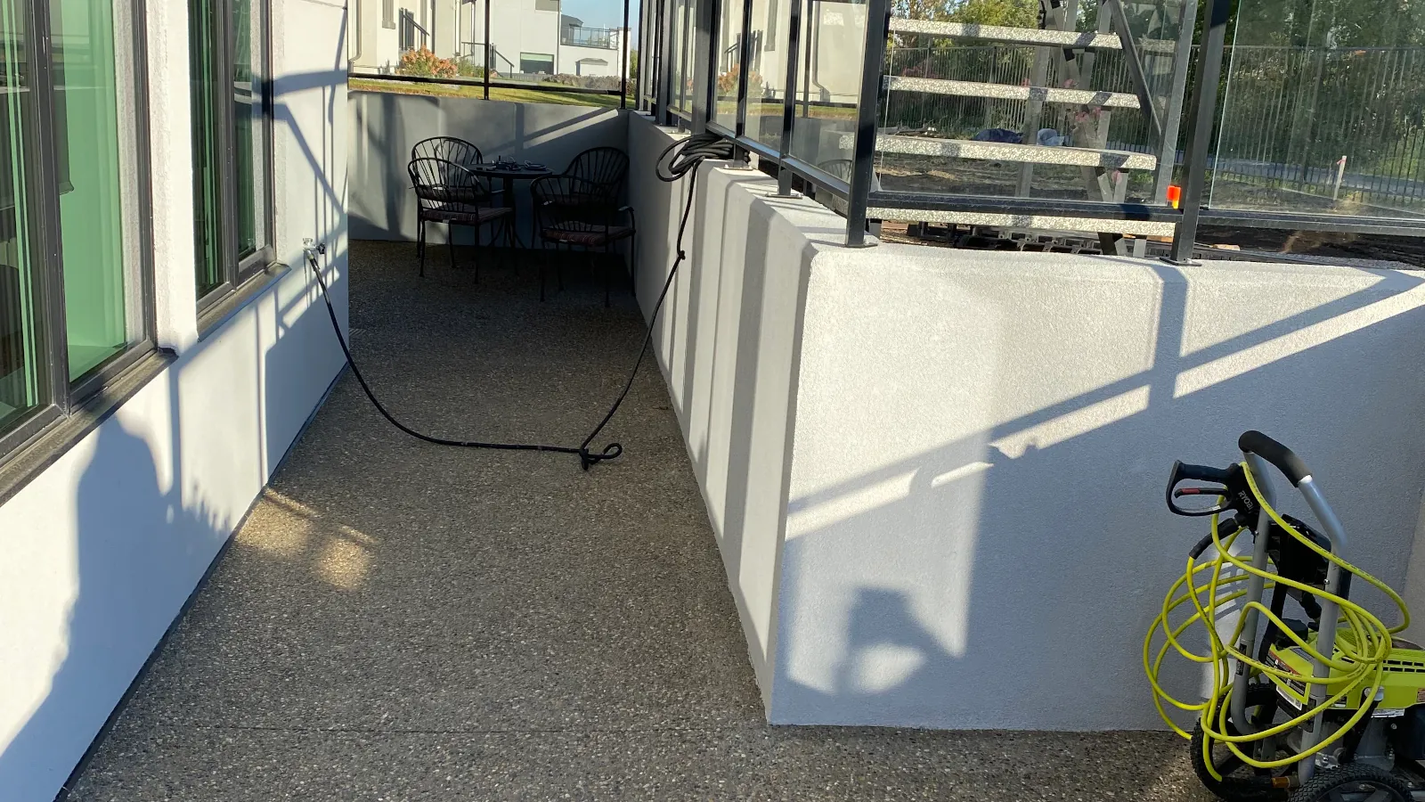 Freshly applied smooth foundation parging finish on residential concrete wall in Edmonton